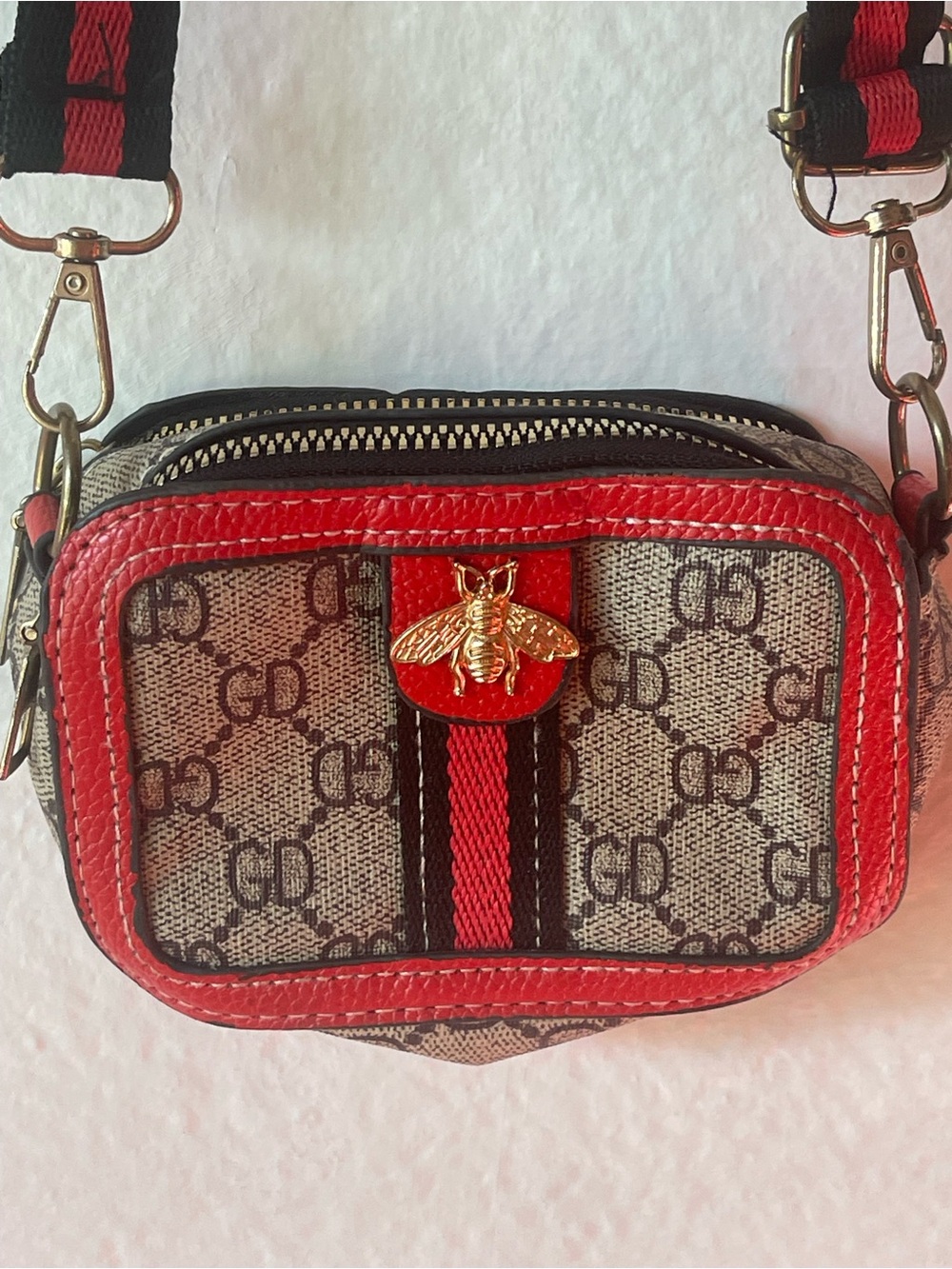 Patterned Crossbody Bag with Red Trim and Gold Bee Accent